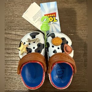 CROCS Kids' Toy Story Woody Clogs with Blue Footbed and Brown Strap Size C5